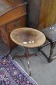 20th century mahogany veneered oval top wine table raised on a turned column with tripod base,