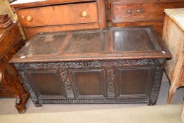 18th century oak coffer, the three panelled lid over a body with three panelled front surrounded