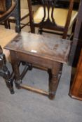 Antique oak joint stool, raised on turned legs, 47cm wide