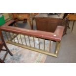 Brass club type fender with upholstered top, 160cm wide