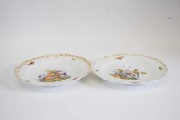 Pair of Meissen plates, the centres decorated with birds with gilt border, flowers and bugs,