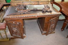 Victorian Gothic oak twin pedestal office desk, the rectangular top with inset writing surface