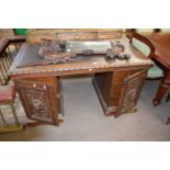 Victorian Gothic oak twin pedestal office desk, the rectangular top with inset writing surface