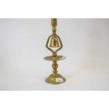 Brass table candlestick with bell below, 34cm high