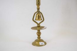 Brass table candlestick with bell below, 34cm high