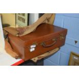 Brown leather small case with partially fitted interior and canvas over-cover, 51cm wide