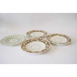 Group of three 19th century Derby plates, the borders with an acorn design in gilt on blue ground,