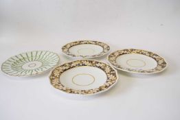 Group of three 19th century Derby plates, the borders with an acorn design in gilt on blue ground,