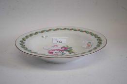 19th century Berlin porcelain plate with floral design to the centre within ribbon border, 23cm