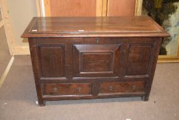 18th century oak mule chest with a hinged lid over a body with three panelled front over two drawers