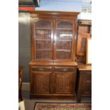 Late Victorian mahogany bookcase cabinet, the top section with two glazed doors opening to shelved