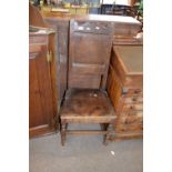 17th century oak side chair with shaped top rail over a single panelled back and a boarded seat