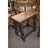 Antique oak joint stool raised on turned legs, 51cm wide