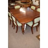 Victorian mahogany extending dining table raised on fluted legs with ceramic casters, together