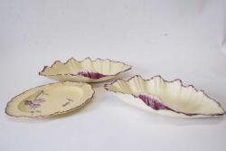 Pair of shell shaped creamware dishes, probably Wedgwood, together with a small shaped plate with