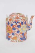 Chinese porcelain tea pot or kettle decorated with an Imari design, 17cm high