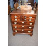 A Georgian style mahogany Norfolk chest with four small drawers, central arched door and three