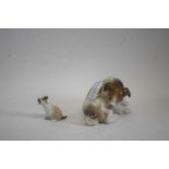 A Lladro model of a terrier with butterfly seated on its tail together with a smaller example (2)