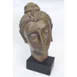 Ceramic bust of an Indian lady, mounted on black rectangular base, 50cm high