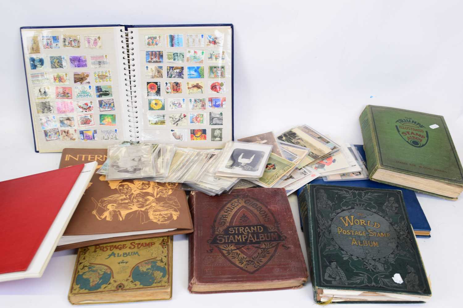 Large box containing copious quantity of postcards and stamp albums