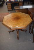 Victorian burr walnut veneered octagonal centre table raised on column supports and four outswept