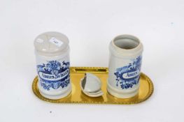 Two Delft drug jars, 19th century, on oval shaped brass tray (covers broken), jars 21cm high