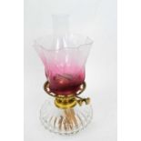 Small Victorian glass oil lamp with cranberry shade, floral design