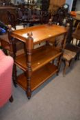Victorian mahogany three tier buffet trolley with turned supports and casters, 87cm wide