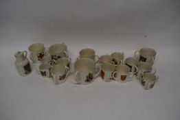 Quantity of Goss tygs with various armorial designs, also including Goss model of a Welsh jack and