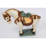 Oriental model of a horse with Han or Tang style glazes, standing on rectangular base, 25cm high