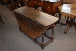 18th century oval oak gateleg table raised on turned legs with stretchers, 126cm wide
