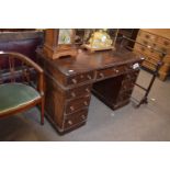 Victorian dark wood twin pedestal desk with nine drawers with small turned knob handles, 123cm wide