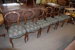 Set of six Victorian balloon back dining chairs, raised on cabriole legs and upholstered with modern
