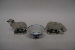 Pair of Continental porcelain sheep and small Continental porcelain blue and white tea bowl