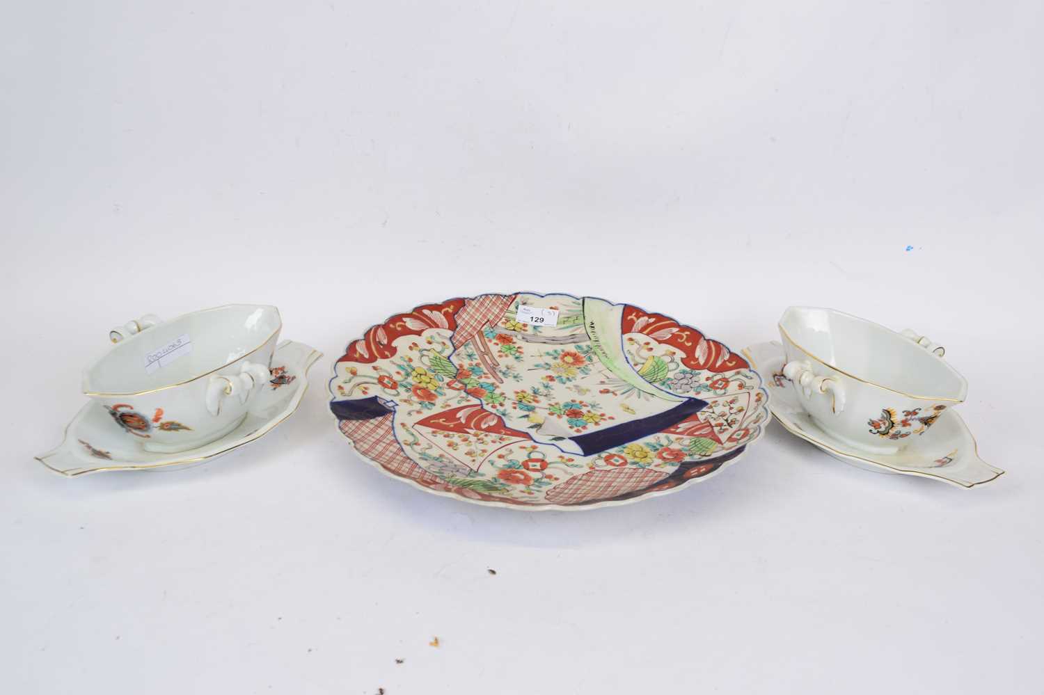 Pair of Continental porcelain tureens and a Japanese Imari charger (3)