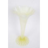 Tall green vaseline glass vase with a striped design on conical foot, 30cm high
