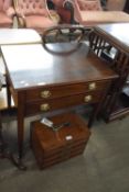 Georgian mahogany two-drawer side table with oval brass handles, raised on tapering square legs with