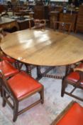 18th century oak drop leaf dining table on bobbin turned legs, 169cm wide when open