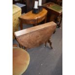 Victorian burr walnut veneered drop leaf table of oval form raised on turned columns with outswept