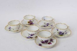 Group of six Continental porcelain Meissen style cups and saucers with floral designs