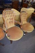 Pair of Victorian walnut framed ladies and gents balloon back chairs with buttoned upholstered and