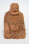 Wooden model of a smiling Chinese deity