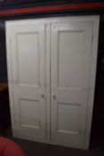 Large early 20th century painted pine two-door kitchen cupboard with shelved interior, 145cm wide