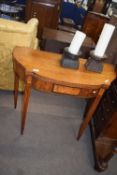 Victorian mahogany and inlaid fold-over card table of bowed form raised on tapering legs, 91cm wide