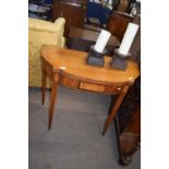 Victorian mahogany and inlaid fold-over card table of bowed form raised on tapering legs, 91cm wide