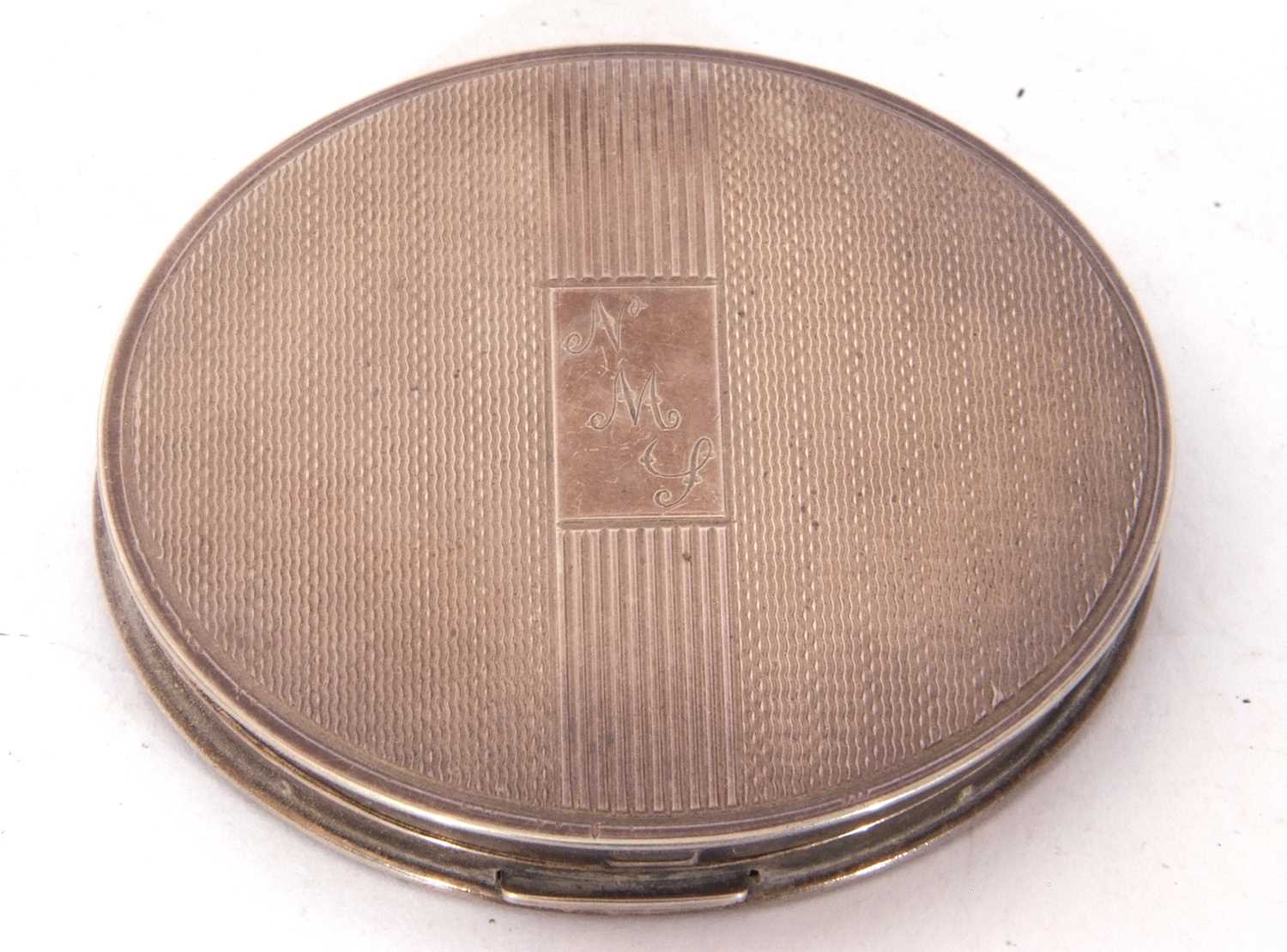 George VI circular compact with banded engine turned decoration having internal mirror and powder