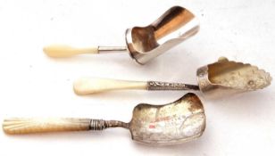 Mixed Lot: three mother of pearl handled and silver caddy spoons/shovels to include a George V