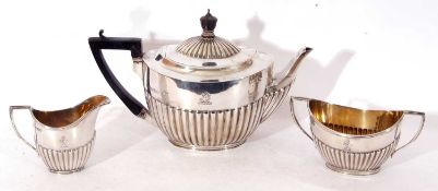 Late Victorian and later three piece tea set of half-fluted oval form, comprising tea pot with