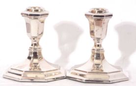 Pair of modern dwarf white metal candlesticks of octagonal form, stamped 835 (loaded)