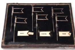 Cased set of Art Deco silver sandwich markers, each in the form of a flag, with removable